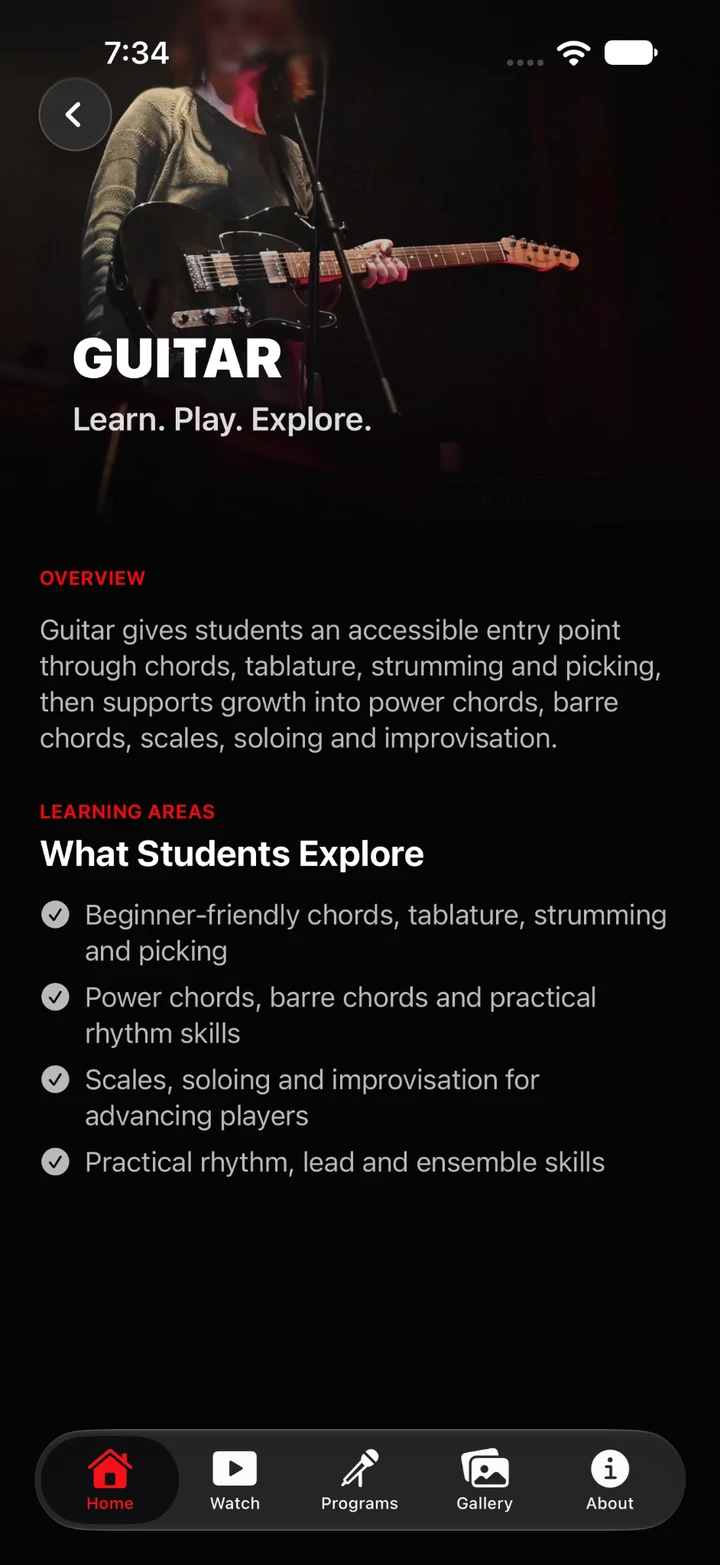 Guitar program page with a guitarist on stage.